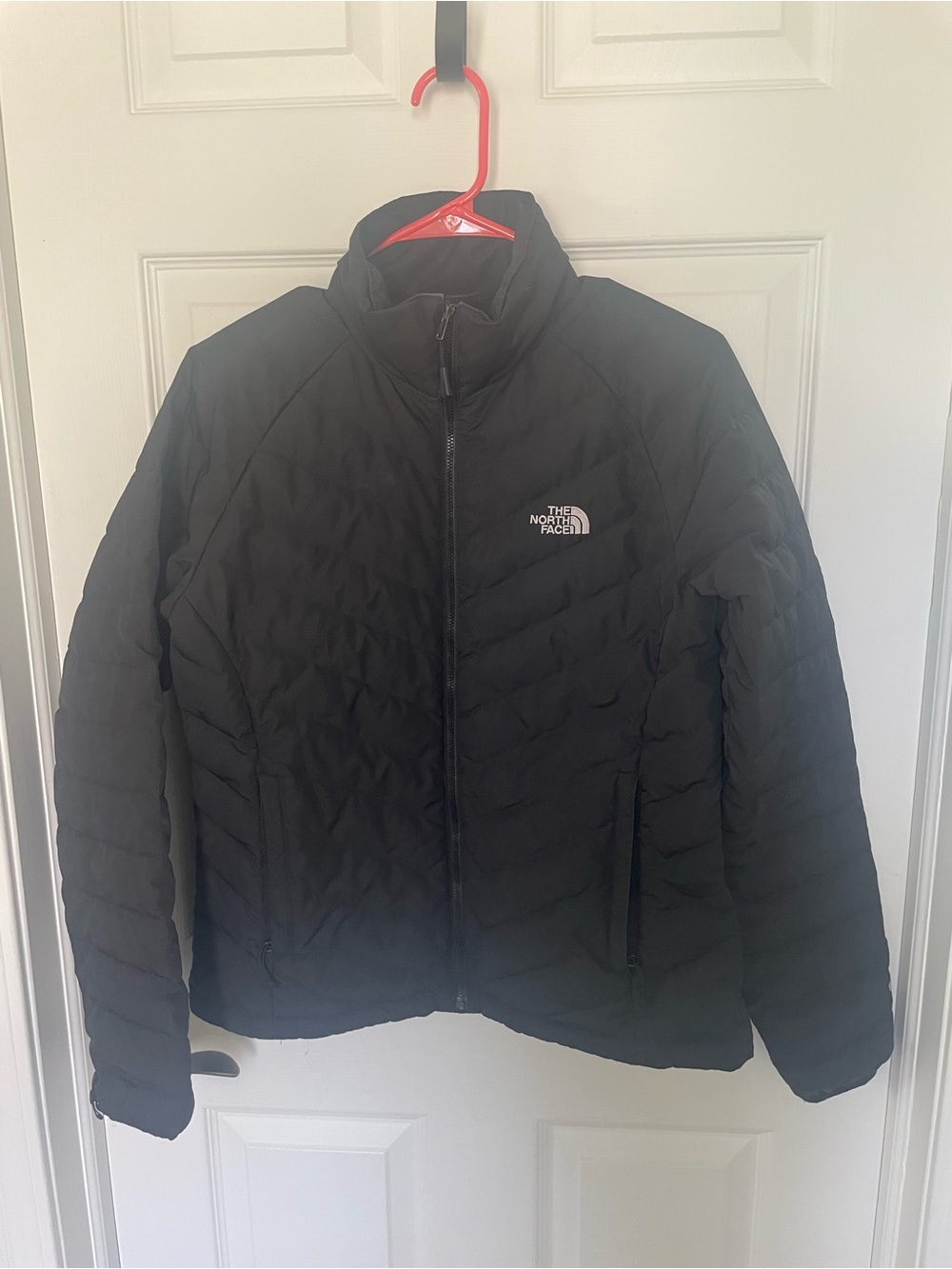 Womens The North Face short black jacket.